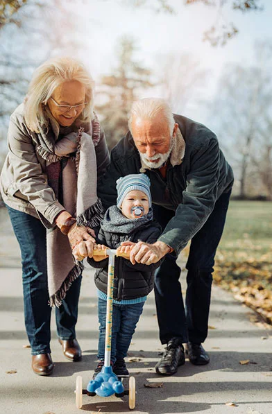 Grandmother comfortably lifting her grandchild