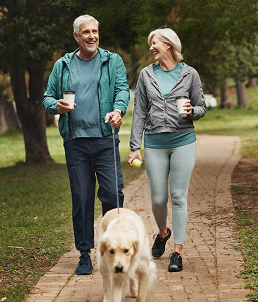 A couple walking their dog together
